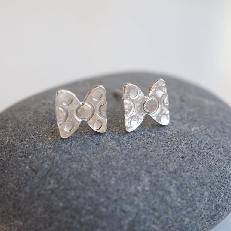 Small silver bowtie earring studs