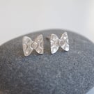 Small silver bowtie earring studs