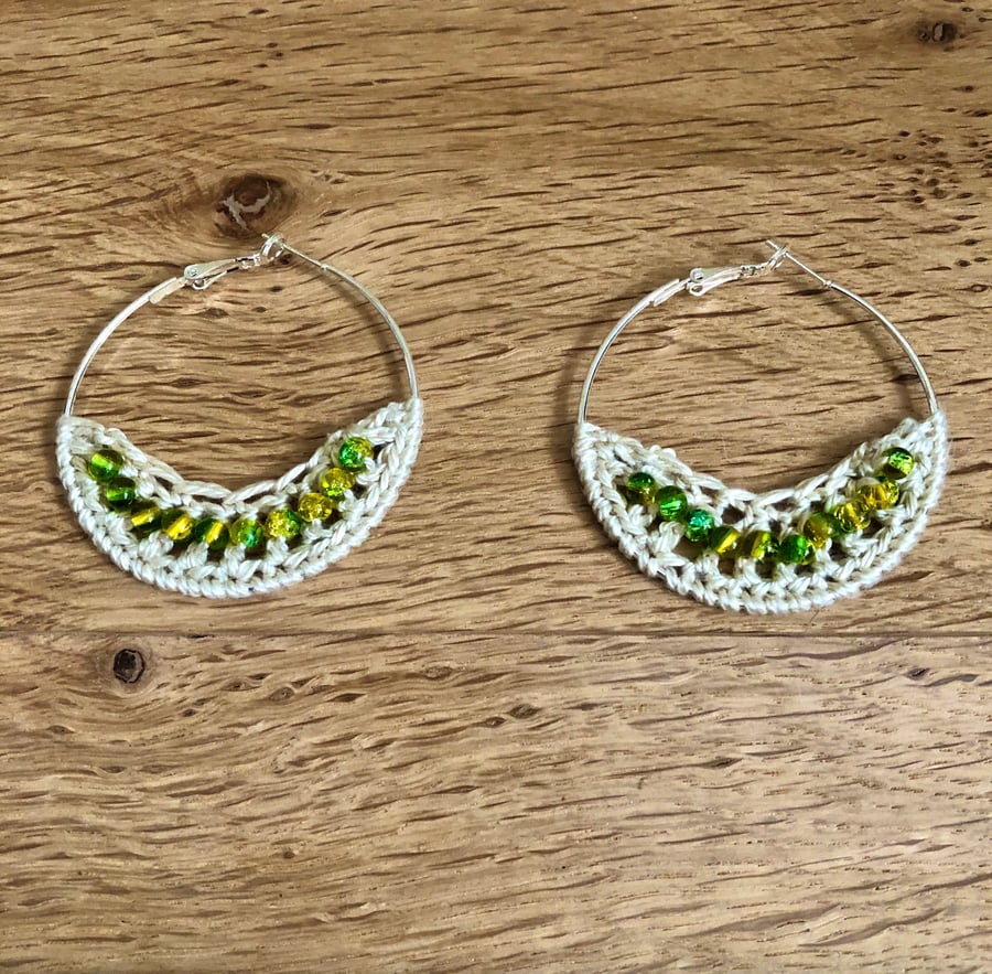 Hello August....Silver plated earrings with crochet and peridot design.