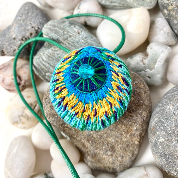 Peacock feather inspired-hand embroidered pendant