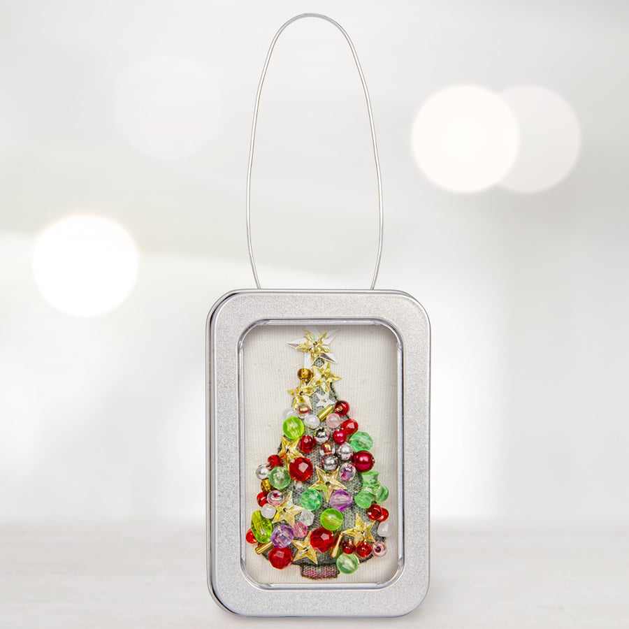 Christmas tree in a little tin with lots of baubles!