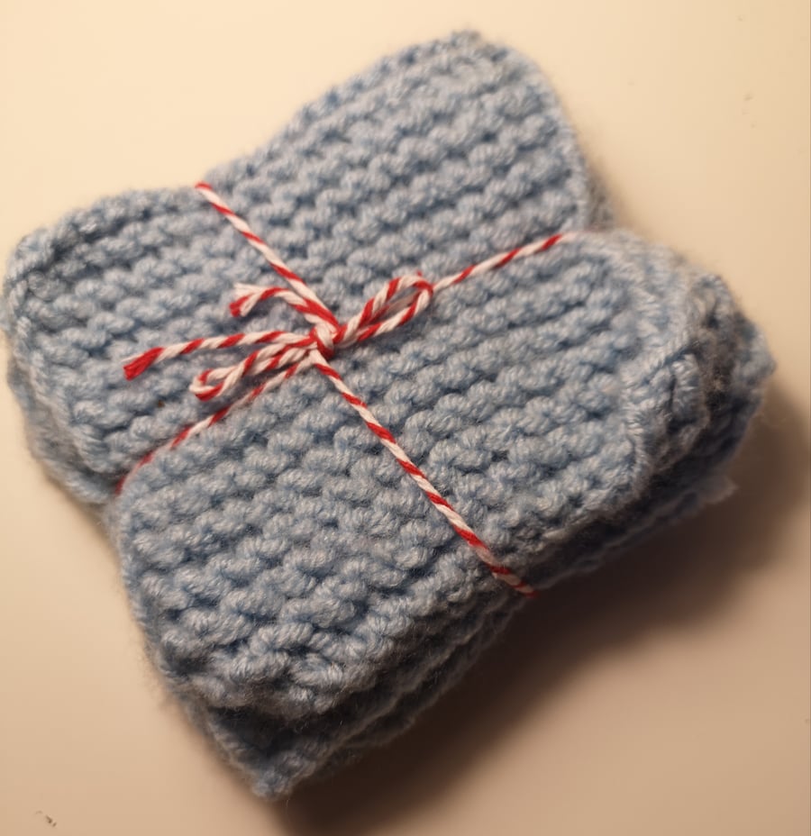 Set of four blue handknitted coasters