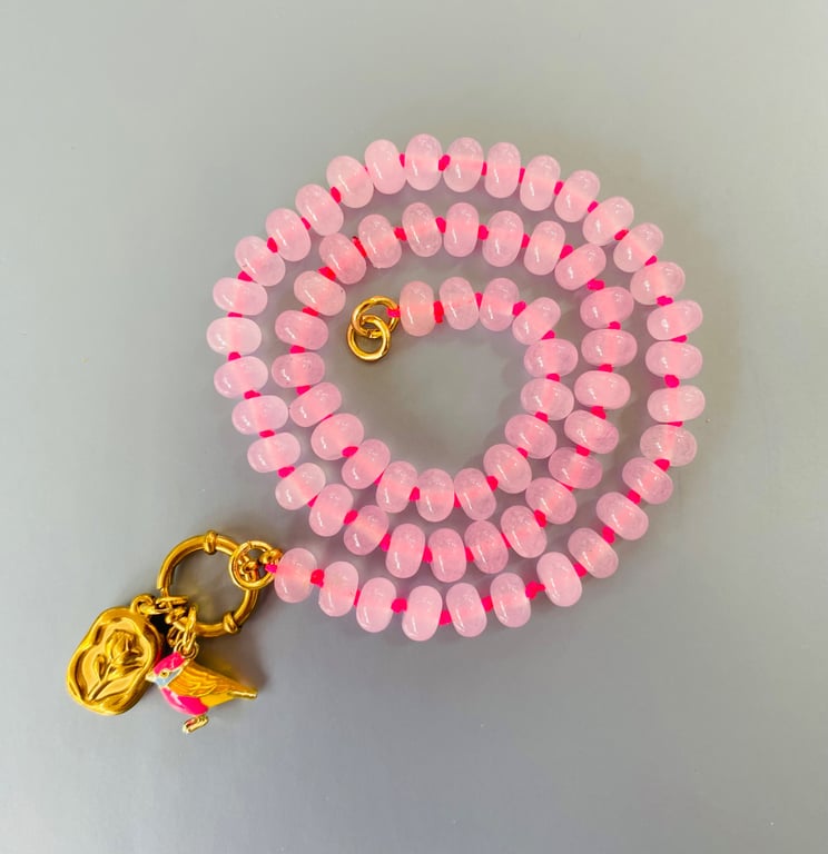 Rose quartz hand knotted beaded necklace with bird and flower charms 