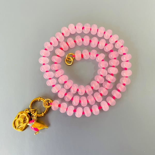 Rose quartz hand knotted beaded necklace with bird and flower charms 