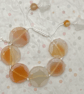 Knotted white cord bracelet with apricot agate stones - Image 1