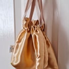 Set of 2 gold satin type fabric drawstring bags