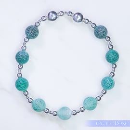 Beaded bracelet with crackle glass and sterling silver green blue stretchy