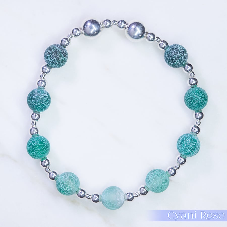 Beaded bracelet with crackle glass and sterling silver green blue stretchy