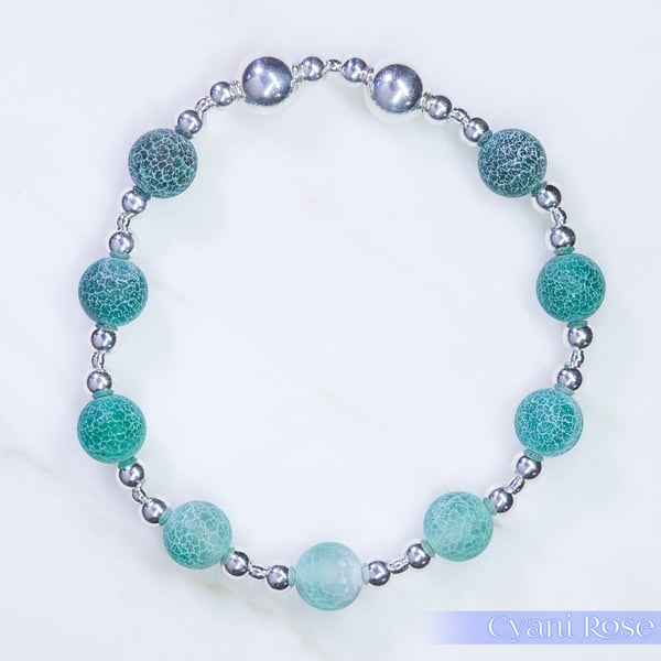 Beaded bracelet with crackle glass and sterling silver green blue stretchy