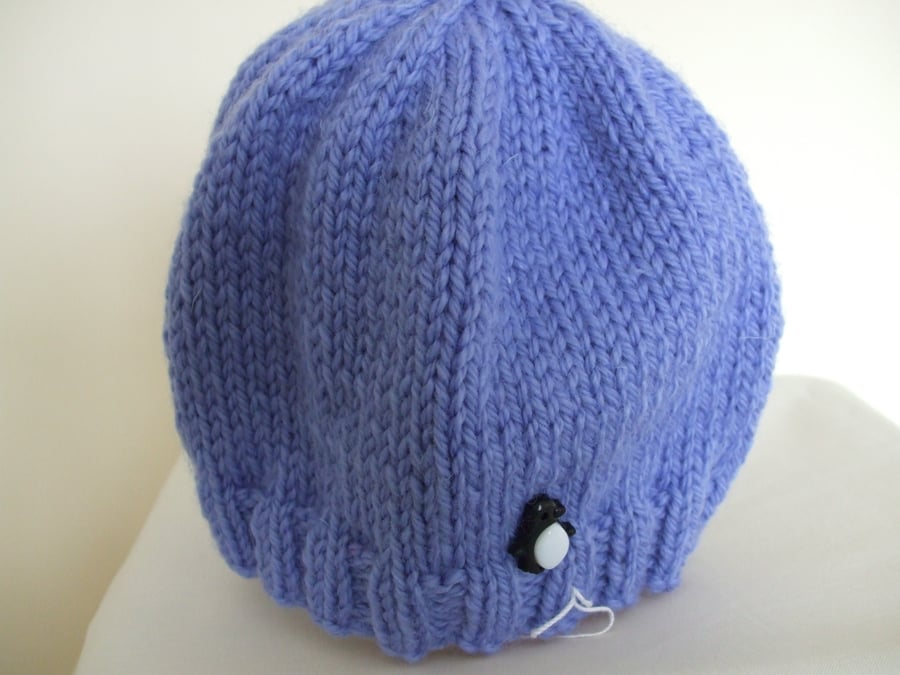 Knitted baby hat in blue