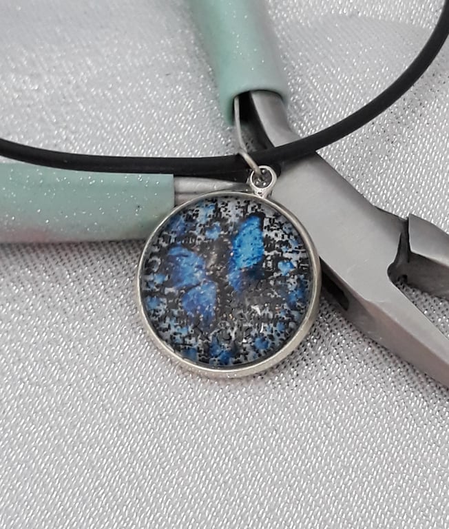 NL142  Blue butterfly picture pendant on cord necklace