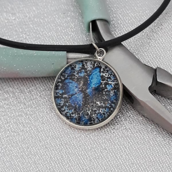 NL142  Blue butterfly picture pendant on cord necklace