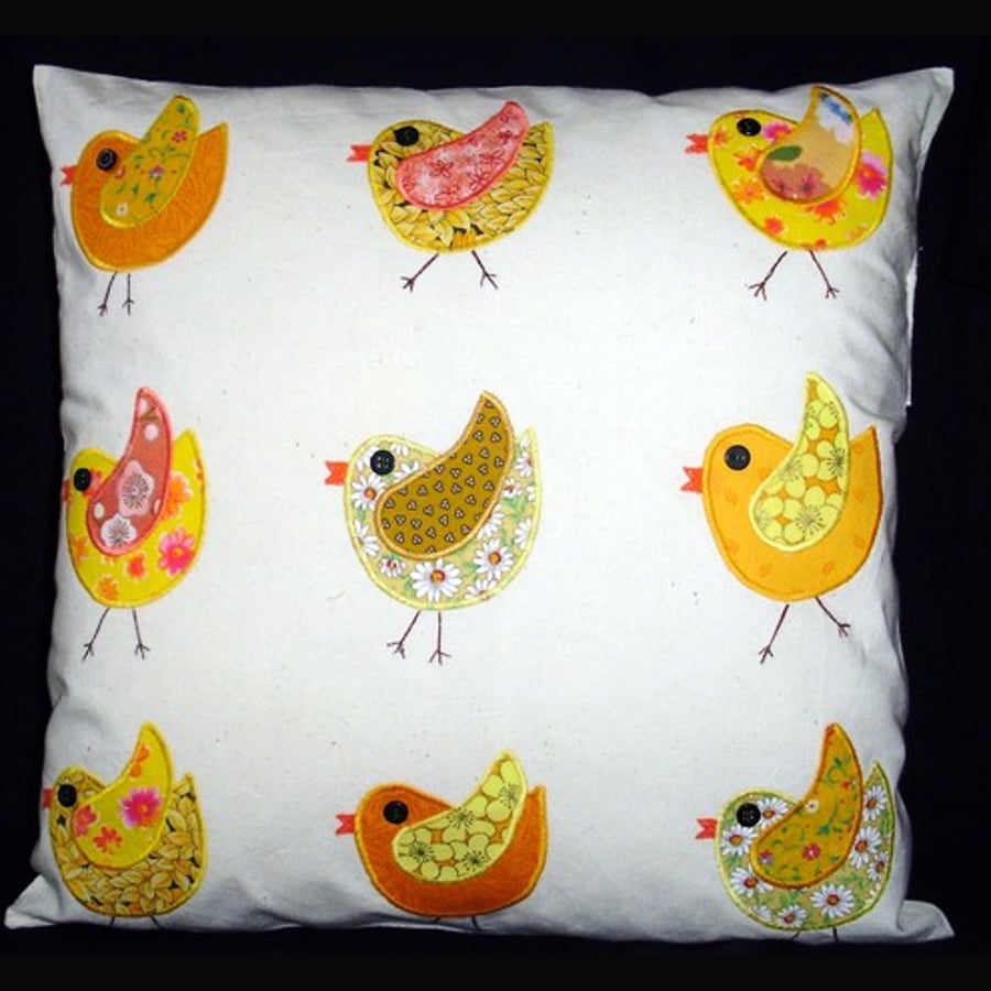 Appliqued cushion with yellow birds