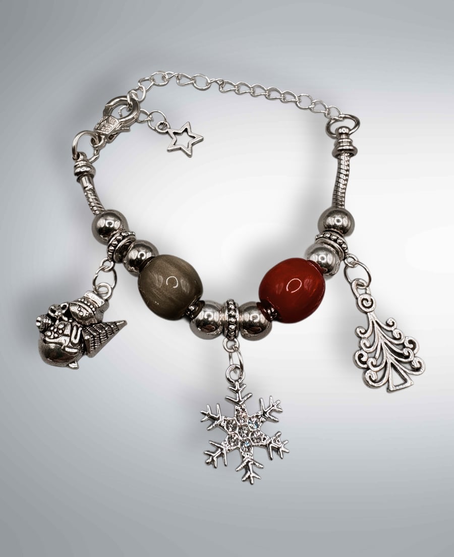 Christmas charm bracelet with traditional colours of red and green 