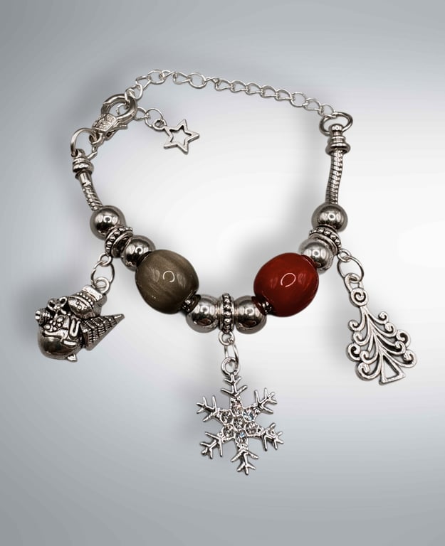 Christmas charm bracelet with traditional colours of red and green 