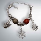 Christmas charm bracelet with traditional colours of red and green 