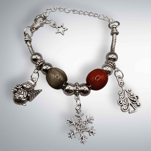 Christmas charm bracelet with traditional colours of red and green 