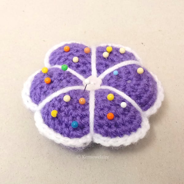 Pin cushion in a purple flower pattern, sewing accessory