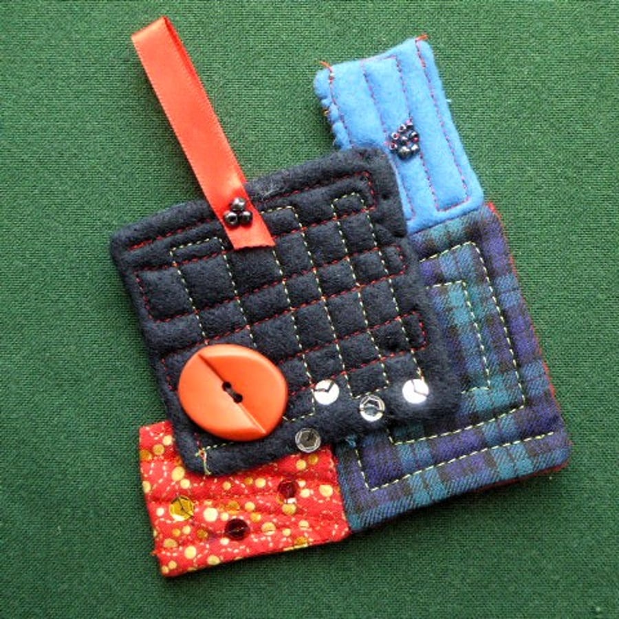 stitched textile hanging decorations