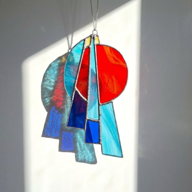 Art Deco Style Suncatcher Stained Glass Blues and Reds with silver chrome finish