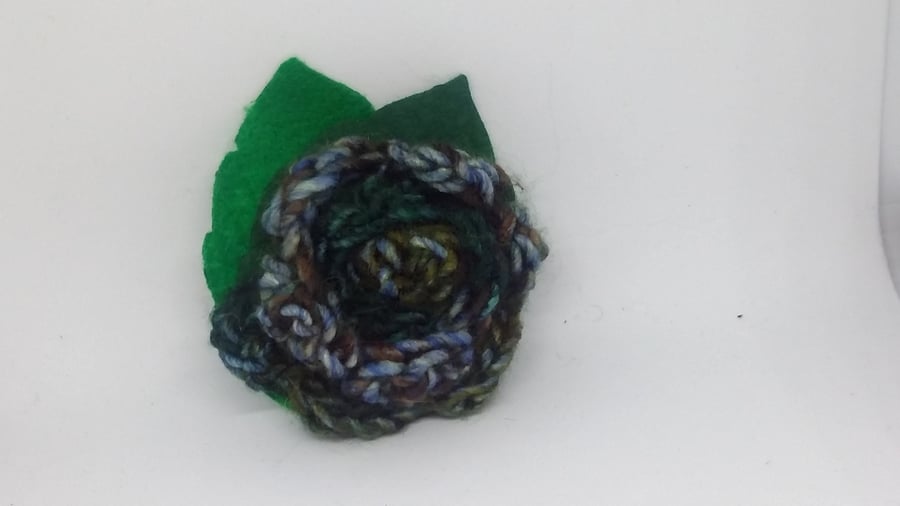 Crochet blue and green flower brooch