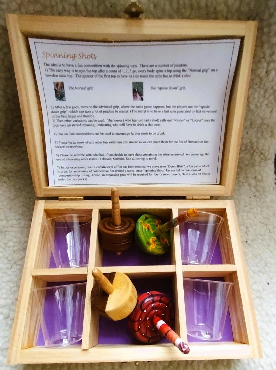 "Spinning Shots".  A fun game with Spinning tops and Shot glasses.