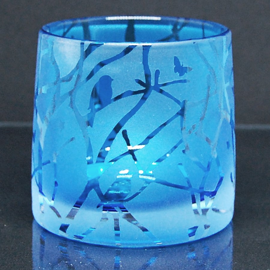 Blue tealight holder with sandblasted twigs, birds and stars design