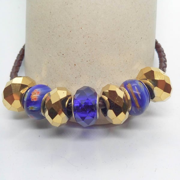 Blue and Gold European Lampwork Bead Bracelet on a Black Plaited Leather Band