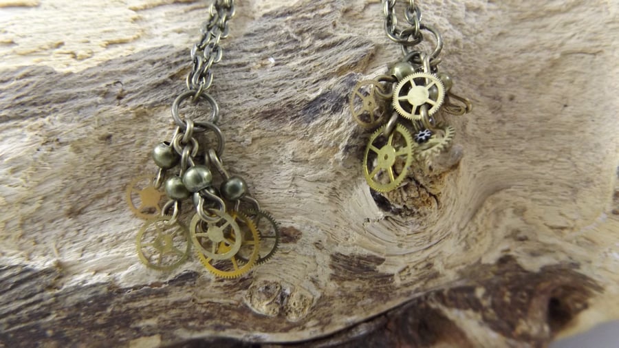 Bronze chain dangle earrings with cogs and wheels of watch steam punk