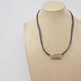 Fabric bead necklace with waxed cotton cord in natural colours
