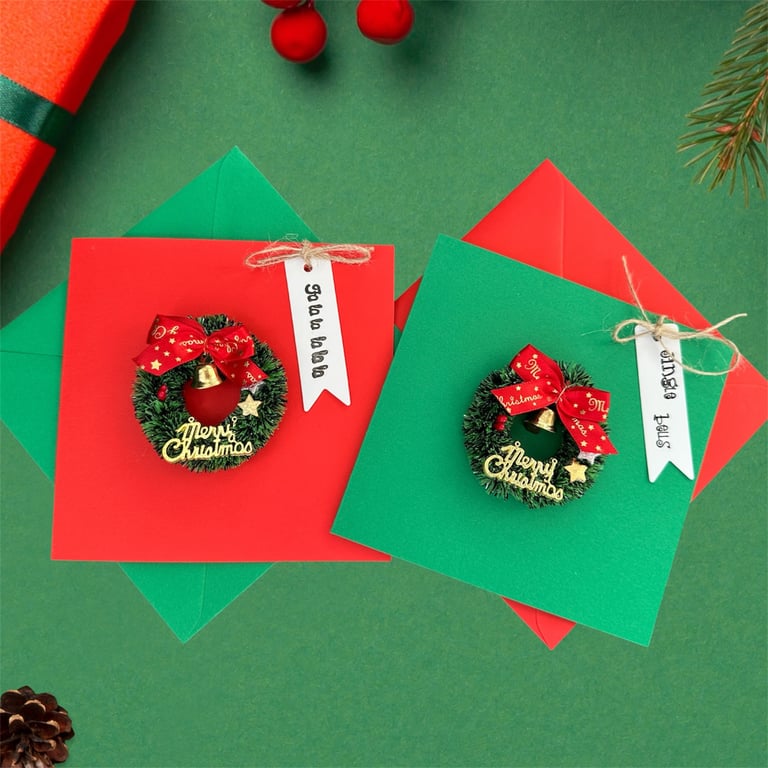 Pack of Christmas cards, wreath design with bells, stars, berries and gift tags.