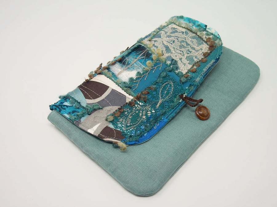 Clutch bag in teal linen, with patchwork flap and button fastening