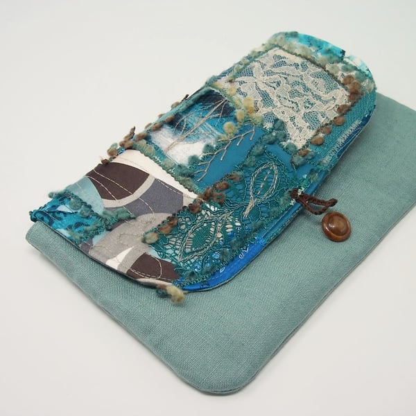 Clutch bag in teal linen, with patchwork flap and button fastening