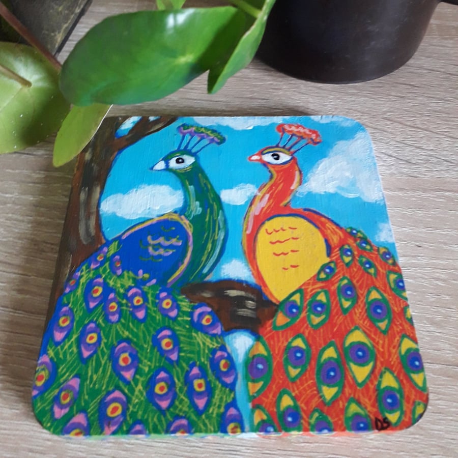 Square pine wooden coaster handpainted with two colourful peacock birds.  