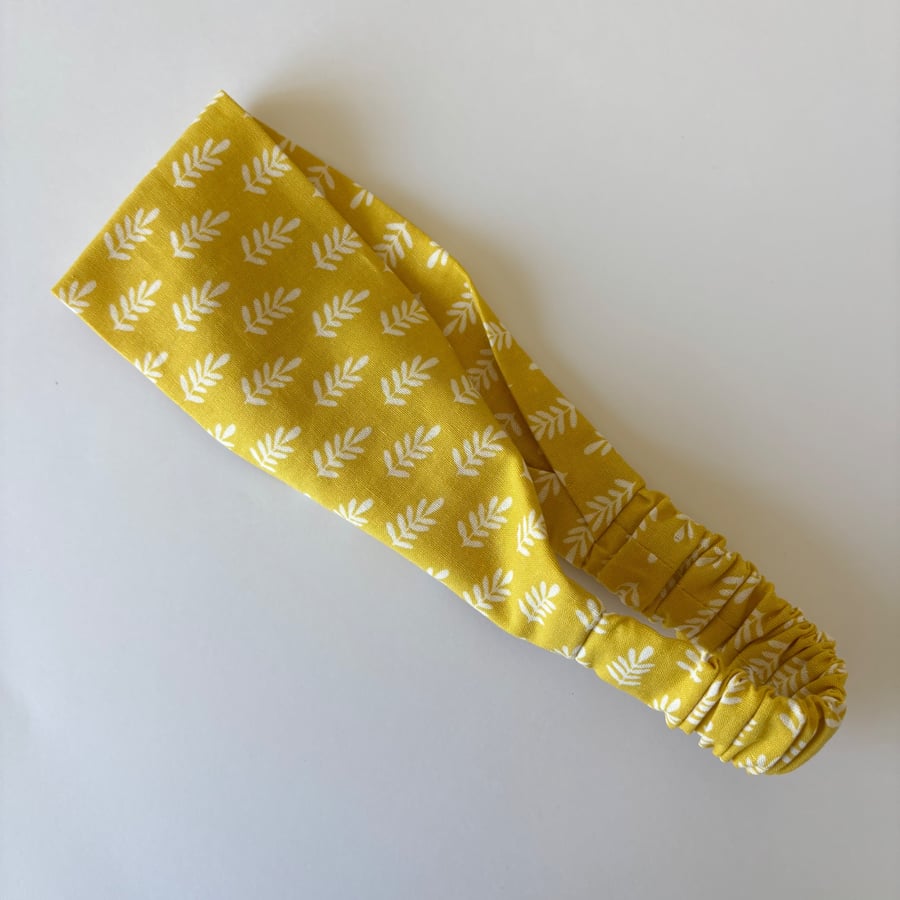 Cotton wide flat headband, yoga headband, in a mustard yellow and white print