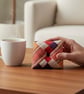 Kente Pin Cushion in cream, red and purple - Image 3
