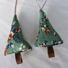 Pair of hand crafted fabric christmas tree decorations with leather trunk