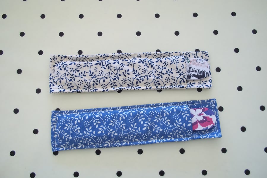 Pair of fabric nail file holders.