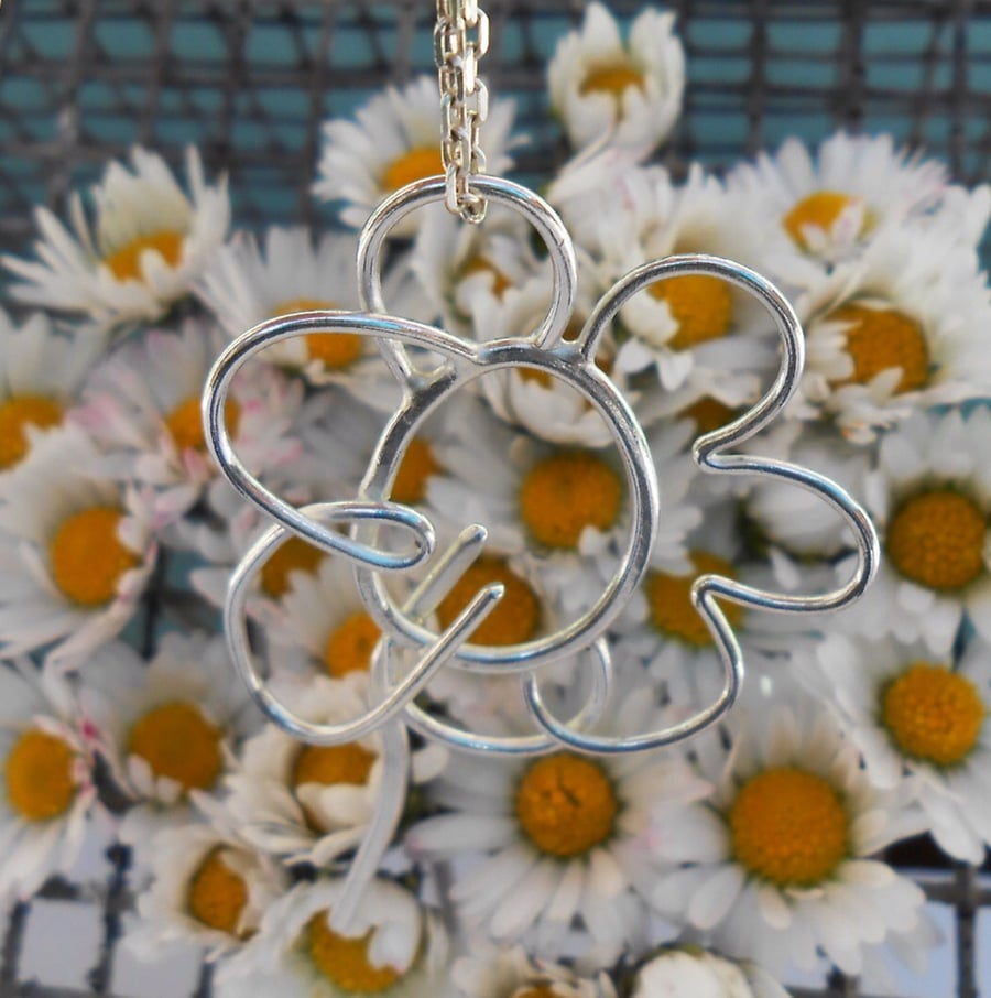 A flower pendant from a child's drawing. Designed from a kids doodle