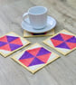 Set of four quilted coasters with a traditional hexagon patchwork design. - Image 1