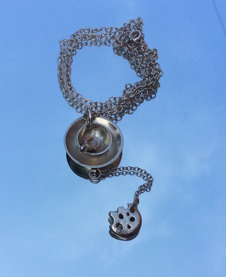 Cup of tea pendant with biscuit