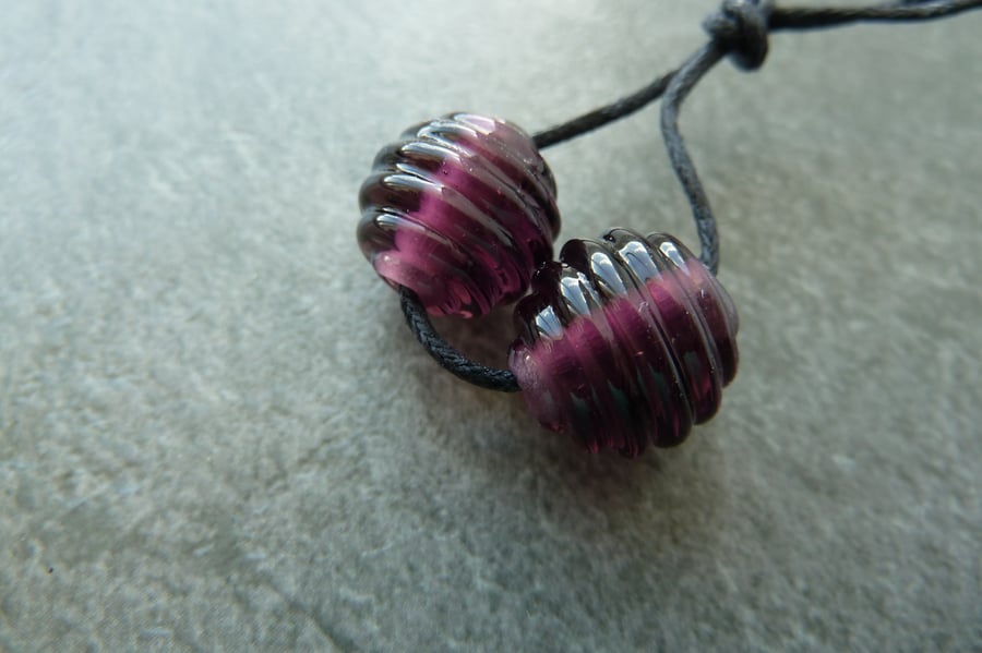 purple ribbed lampwork glass beads