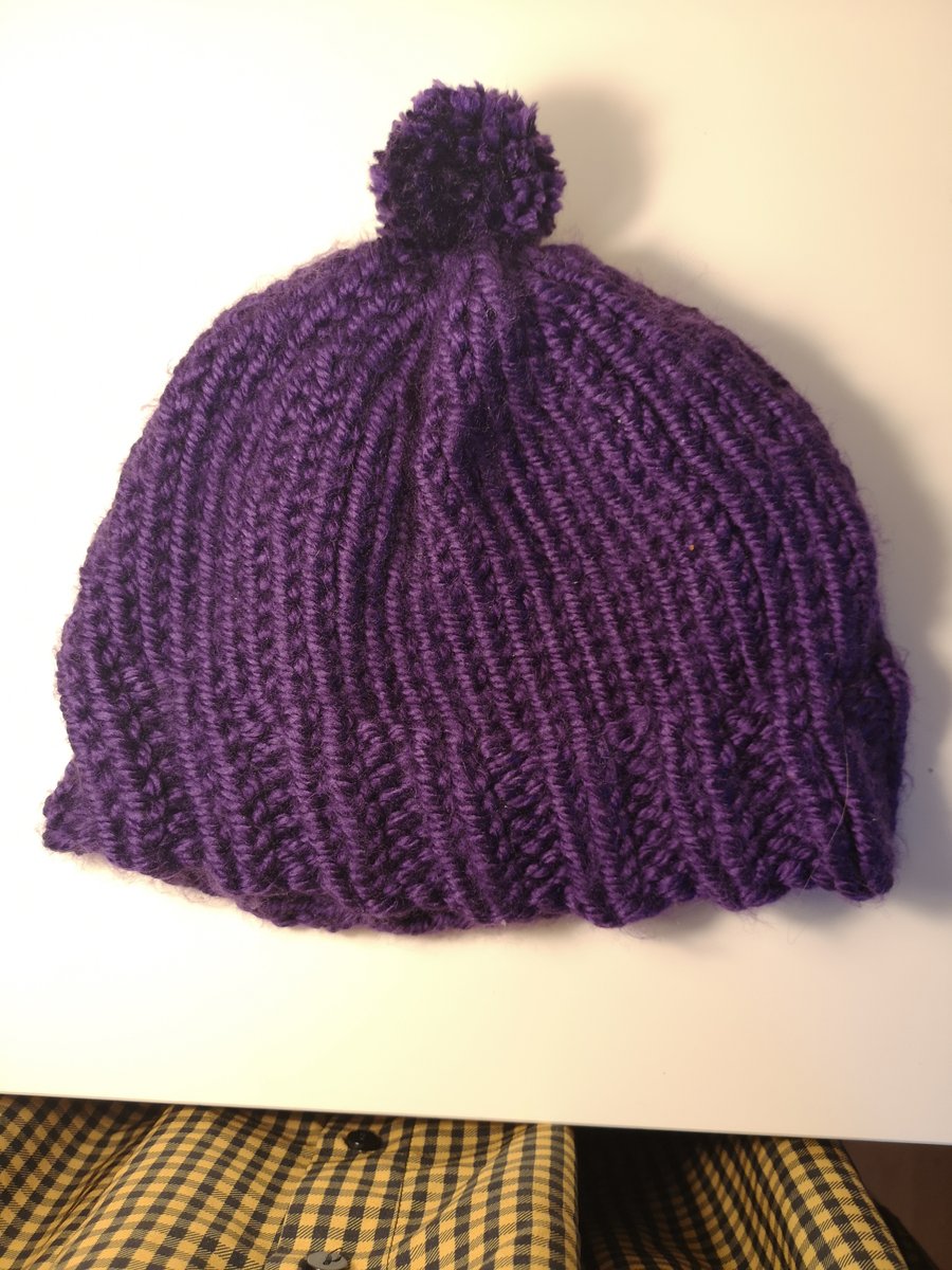 Handknitted purple bobble hat