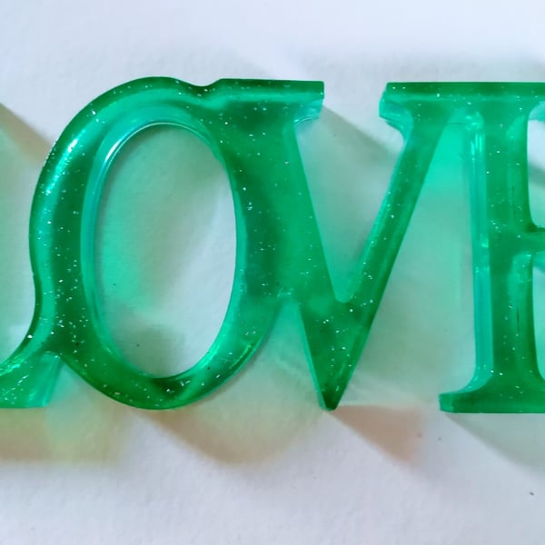 Freestanding love sign in green