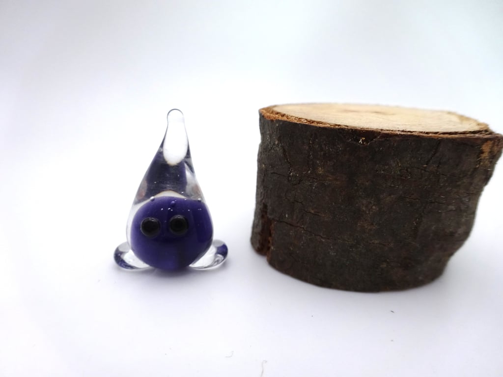 small glass wisp figure