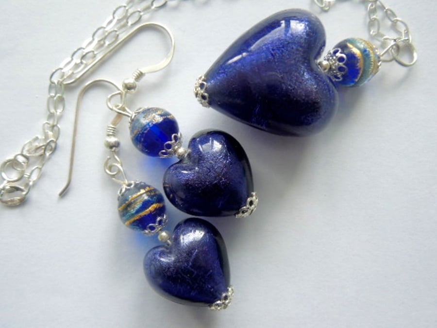 Murano glass purple pendant and earrings set with sterling silver.