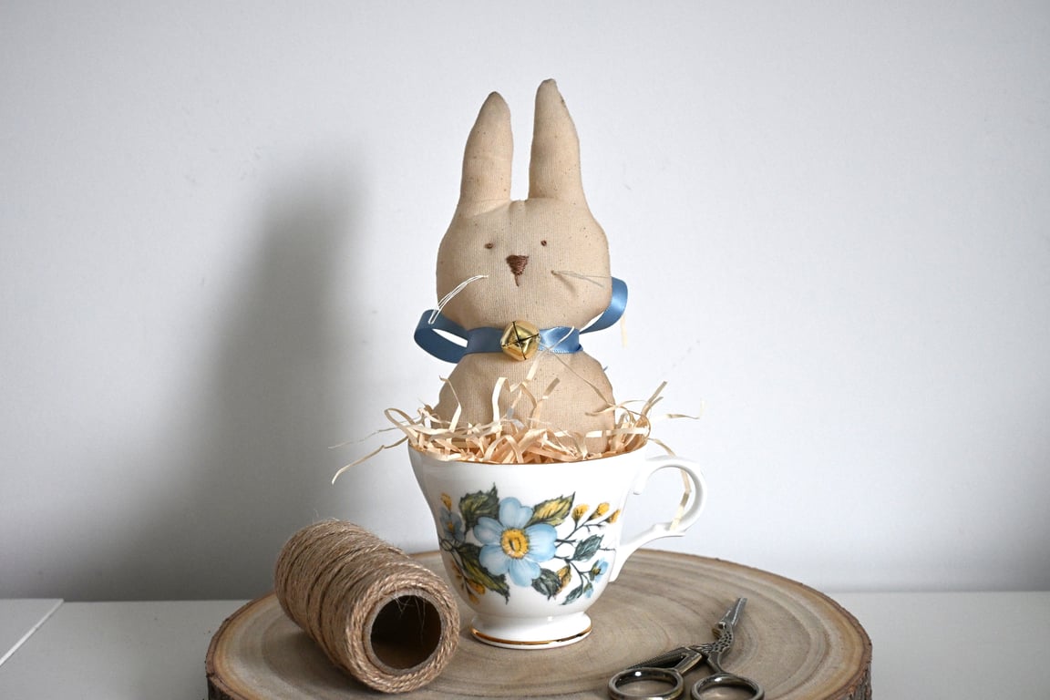 Primitive rabbit in a teacup keepsake