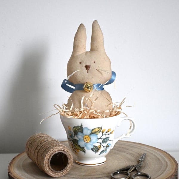 Primitive rabbit in a teacup keepsake