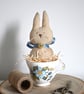 Primitive rabbit in a teacup keepsake