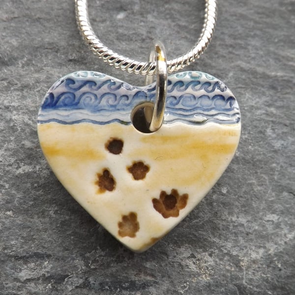 Handmade ceramic paw prints on my heart pendant